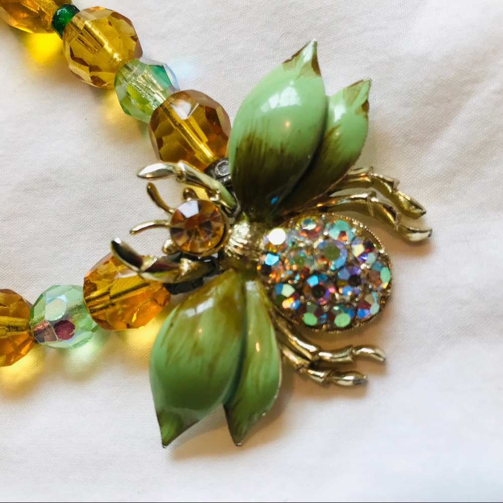 Beaded necklace with moth pendant